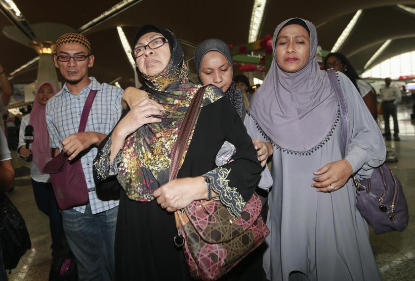 Family members of those onboard the missing Malaysia Airlines flight MH370 walk into the waiting area at Kuala Lumpur International Airport in Sepang March 8, 2014. u00e2u20acu201d Reuters pic