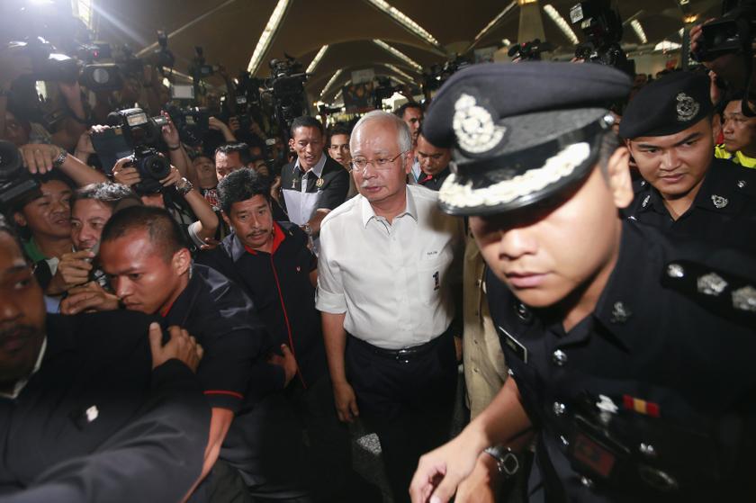 Prime Minister Datuk Seri Najib Razak (centre) arrives at the holding area for family and friends of passengers aboard missing Malaysia Airlines flight MH370, at Kuala Lumpur International Airport in Sepang March 8, 2014. u00e2u20acu201d Reuters pic