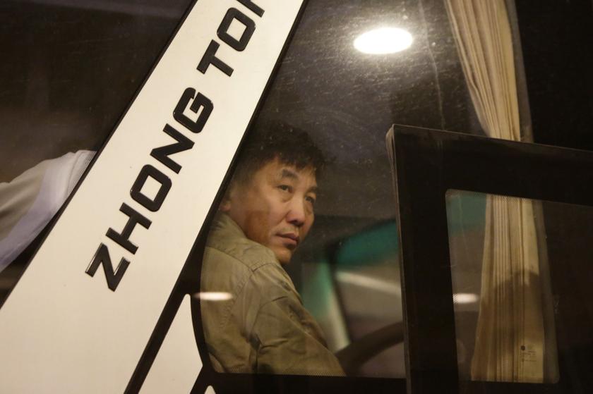 A relative of a passenger on board the Malaysia Airlines Flight MH370 looks out from a bus as he and other family members wait to leave for Beijing airport and take a Malaysia Airlines flight to Kuala Lumpur, in Beijing March 29, 2014. u00e2u20acu201d Reuters pic