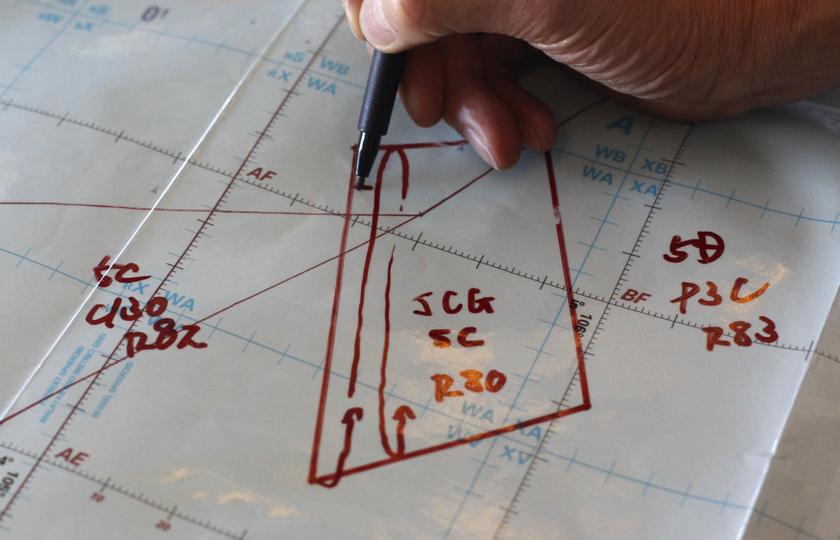 A Japan Coast Guard explains their search plan in an area of operation, on board their Gulfstream V Jet aircraft customized for search and rescue operations, as they search for  MH370 over the waters of the South China Sea March 15, 2014.u00c2u00a0u00e2u20acu201d Reuters pic