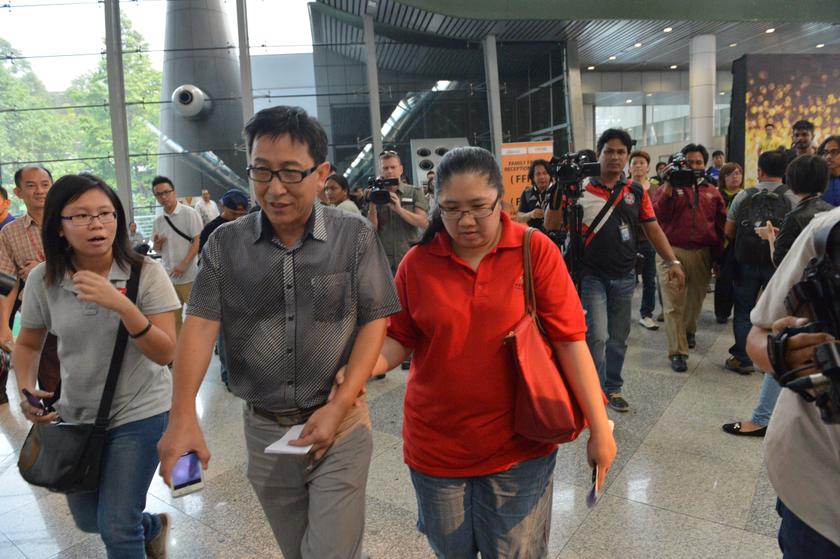 Family members of those onboard the missing Malaysia Airlines flight walk into the waiting area at Kuala Lumpur International Airport in Sepang March 8, 2014. u00e2u20acu201d Reuters pic