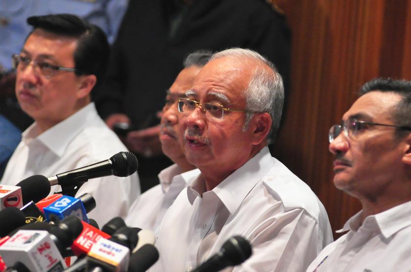 Prime Minister, Datuk Seri Najib Razak (centre) flanked by Datuk Seri Liow Tiong Lai, (4th left) Tan Sri Muhyiddin Yassin (left) and Datuk Seri Hishamuddin Hussein speak to members of the press at the Sama-Sama Hotel in Sepang, March 8, 2014. u00e2u20acu201d Picture 