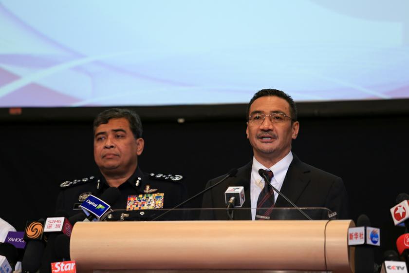 Acting Transport Minister Datuk Seri Hishammuddin Tun Hussein (right) holds the daily MH370 press conference at PWTC, on March 25, 2014. u00e2u20acu201d Picture by Saw Siow Feng