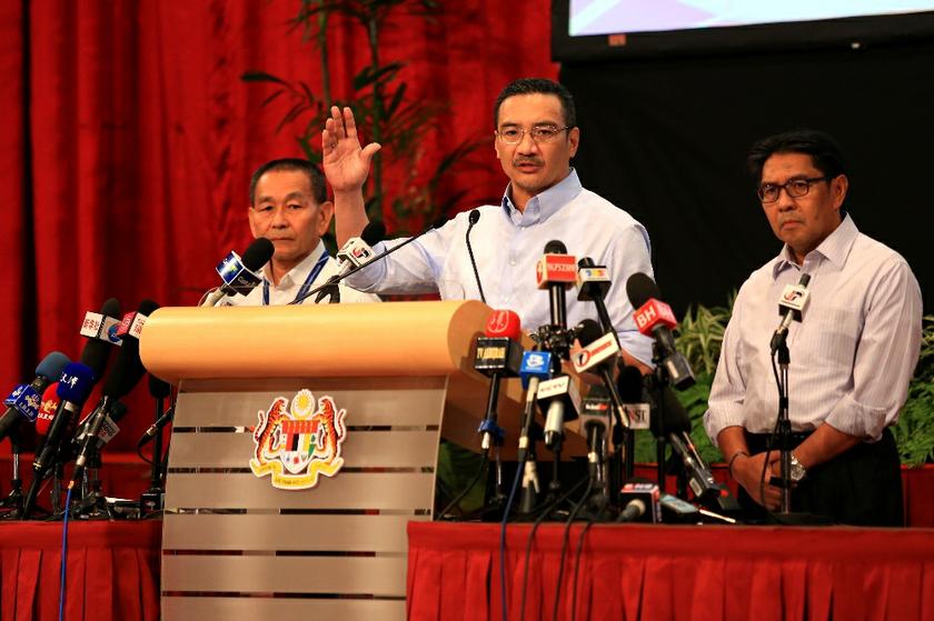 Datuk Seri Hishammuddin Hussein (centre) speaks at the daily MH370 press conference at the PWTC in Kuala Lumpur, on March 28, 2014. u00e2u20acu201d Picture by Saw Siow Feng