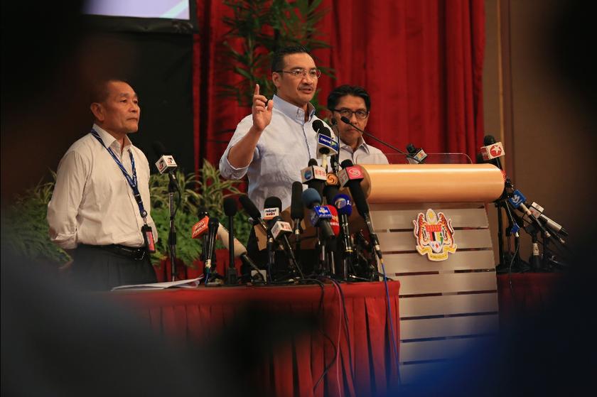 Datuk Seri Hishammuddin Hussein (centre) speaks at the daily MH370 press conference at the PWTC in Kuala Lumpur, on March 28, 2014. u00e2u20acu201d Picture by Saw Siow Feng
