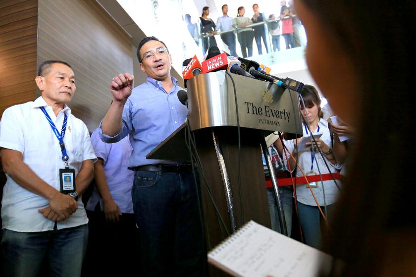 Acting Transport Minister Datuk Seri Hishammuddin Hussein speaks to the media during a visit to the family members of passengers on board flight MH370 at Everly Hotel, Putrajaya, March 29, 2014. u00e2u20acu2022 Picture by Saw Siow Feng