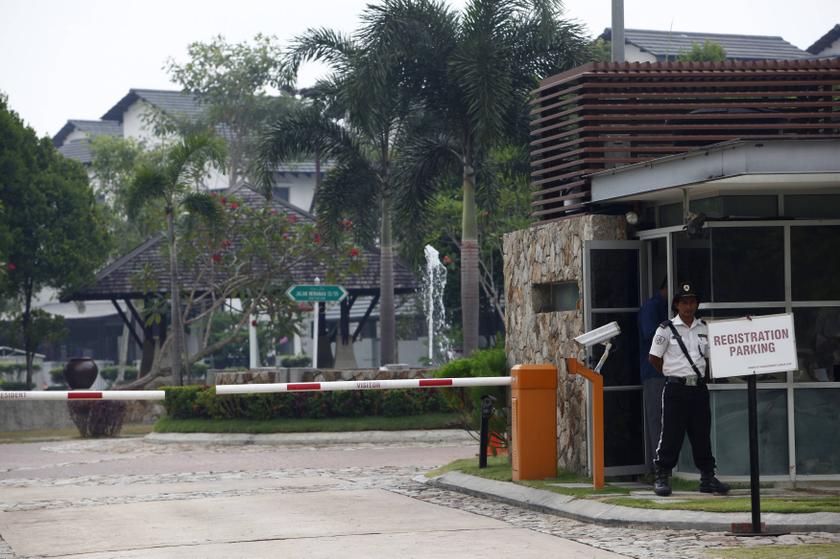 A security guard stands at the entrance of a compound where the house of pilot Zaharie Ahmad Shah is located in Shah Alam, near Kuala Lumpur March 15, 2014. u00e2u20acu201d Reuters pic