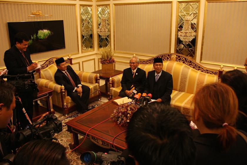 Sarawak Chief Minister Tan Sri Adenan Satem (seated, right).  