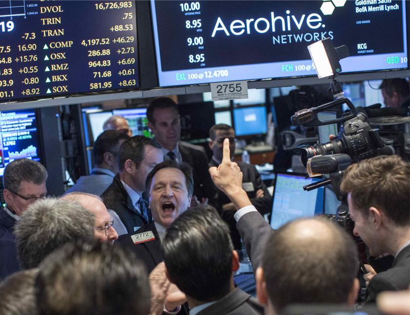 Thomas Facchine (centre) yells out the opening price for Aerohive during the company's IPO at the New York Stock Exchange March 28, 2014. u00e2u20acu201d Reuters pic