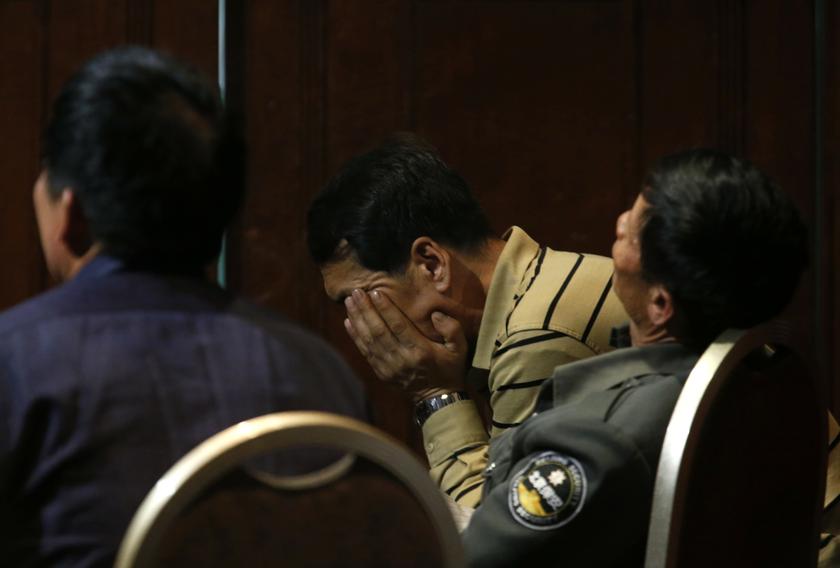 Family members of passengers aboard the missing Malaysia Airlines Flight MH370 react as they watch Malaysia's Prime Minister Datuk Seri Najib Razak speak on a television screen at a hotel in Beijing, March 15, 2014. u00e2u20acu201d Reuters pic