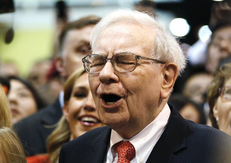 Berkshire Hathaway Chairman Warren Buffett reacts at a newspaper throwing competition before the company's annual meeting in Omaha May 4, 2013. u00e2u20acu201d Reuters pic