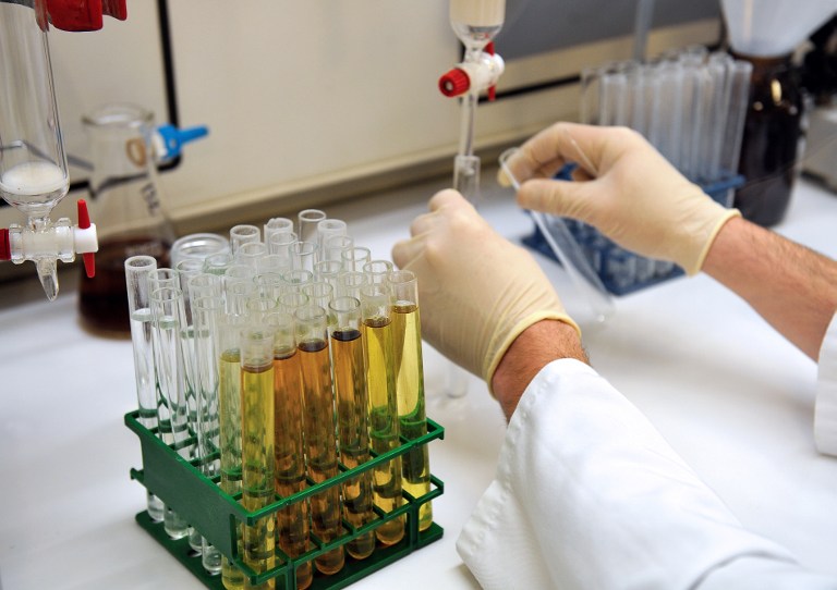 A researcher handles pipettes in a laboratory of French biopharmaceutical company Genfit. Following successful listings by companies in the US, European health companies are lining up to sell shares in initial public offerings. AFP pic