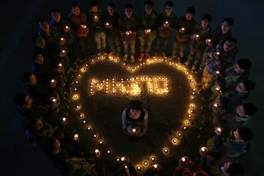 Construction site workers light candles to pray for passengers of the missing flight MH370, in Wuhan, Hubei province, March 13, 2014. u00e2u20acu201d Reuters pic