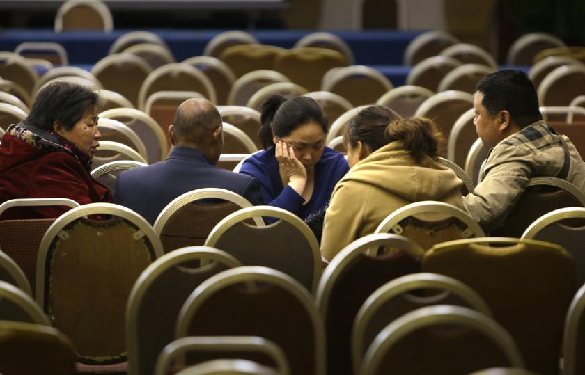 Relatives of passengers aboard Malaysia Airlines flight MH370 chat after a meeting with representatives from the airline at Lido Hotel in Beijing, March 16, 2014. u00e2u20acu201d Reuters pic