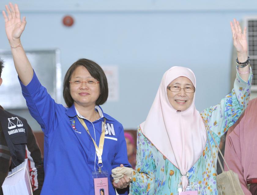 Chew and Wan Azizah waving to supporters after filing their nomination papers — Picture by Firdaus Latif