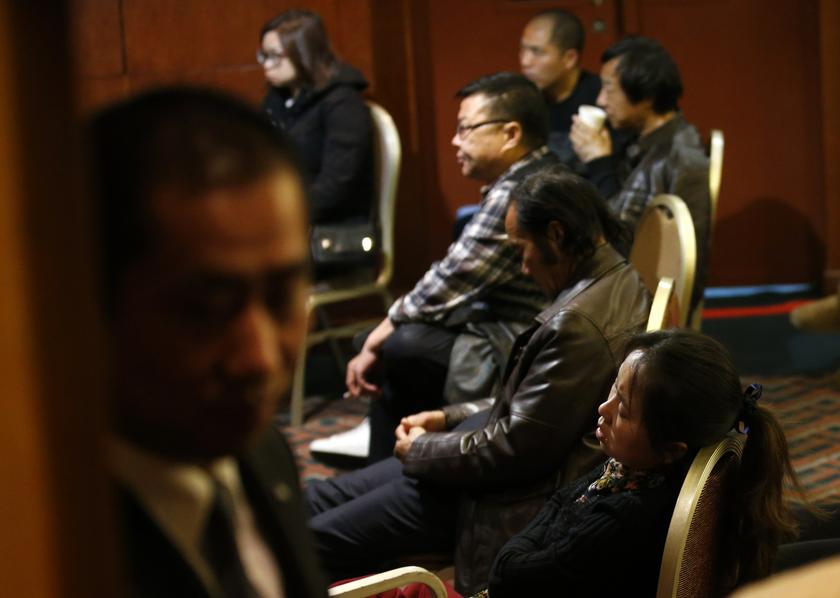 Family members of passengers aboard the missing Malaysia Airlines Flight MH370 sit on chairs as they wait for news at a hotel in Beijing March 14, 2014. u00e2u20acu201d Reuters pic
