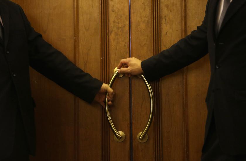 Hotel security staff members guard outside a rest area for relatives of passengers of Malaysia Airlines flight MH370, at Lido Hotel in Beijing, March 12, 2014. u00e2u20acu201d Reuters pic