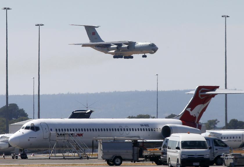 A Chinese Air Force Ilyushin Il-76 aircraft used in the search for Malaysia Airlines flight MH370 prepares to land at Perth International Airport, March 27, 2014, as severe weather halted an air and sea search. u00e2u20acu201d Reuters pic
