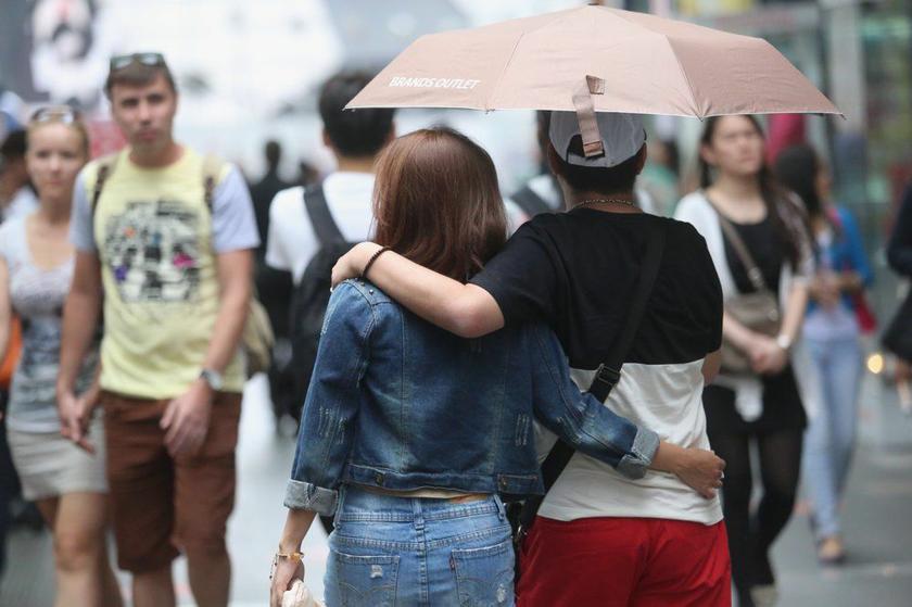 A couple walks in Bukit Bintang. In 2012, one divorce was filed every 10 minutes. u00e2u20acu2022 Picture by Choo Choy May