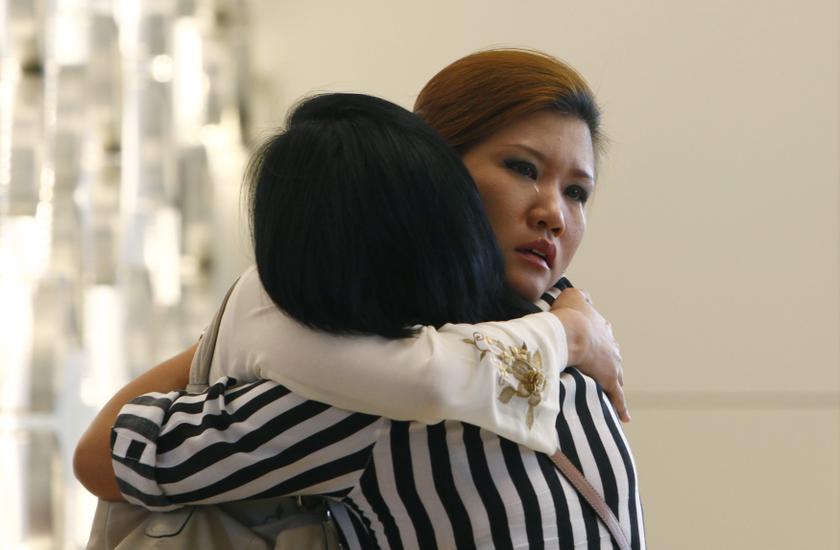 Relatives of a passenger onboard the missing Malaysia Airlines flight MH370 cry inside a hotel they are staying, in Putrajaya March 10, 2014. u00e2u20acu201du00c2u00a0Reuters pic