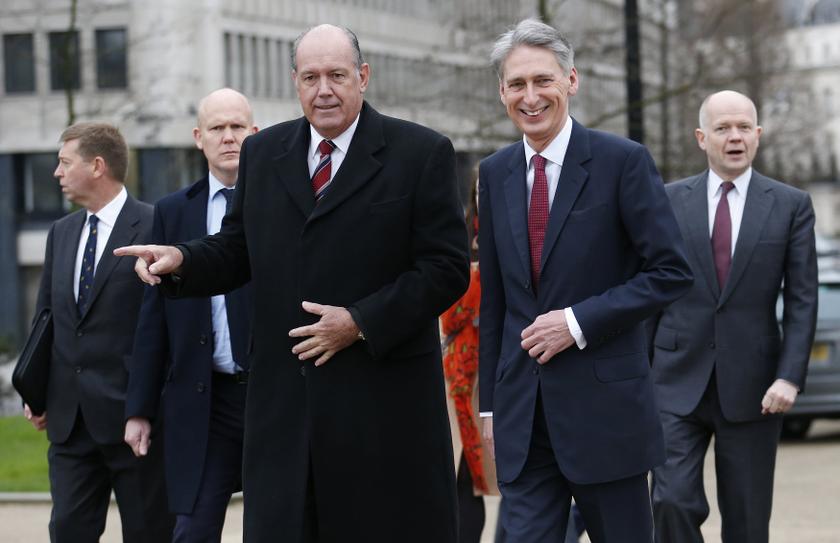 Australia's Defence Minister David Johnston (C), Britain's Defence Secretary Philip Hammond (2nd R) and Britain's Foreign Secretary William Hague depart from a wreath laying ceremony marking the centenary of the start of World War One, at the Australian W