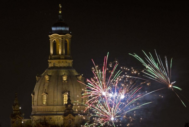 Fireworks explode over Dresden's Church of Our Lady (Frauenkirche) on New Year's Eve on December 31, 2013.