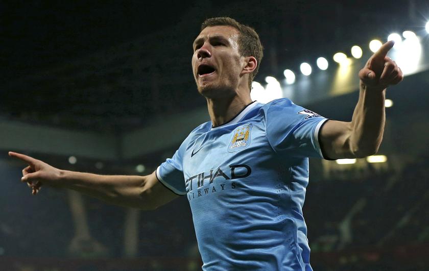 Manchester City's Edin Dzeko celebrates his second goal against Manchester United during their English Premier League soccer match at Old Trafford in Manchester, northern England March 25, 2014. u00e2u20acu201d Reuters pic