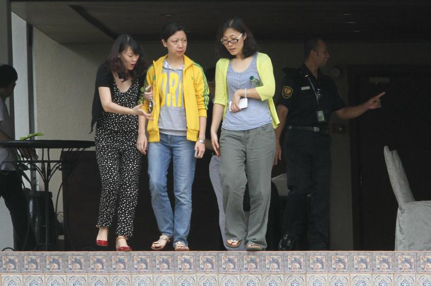 Family members of MH370's  passengers walking out from a Cyberjaya hotel room after viewing Najib's press conference, March 15, 2014. u00e2u20acu201d Picture by Choo Choy May