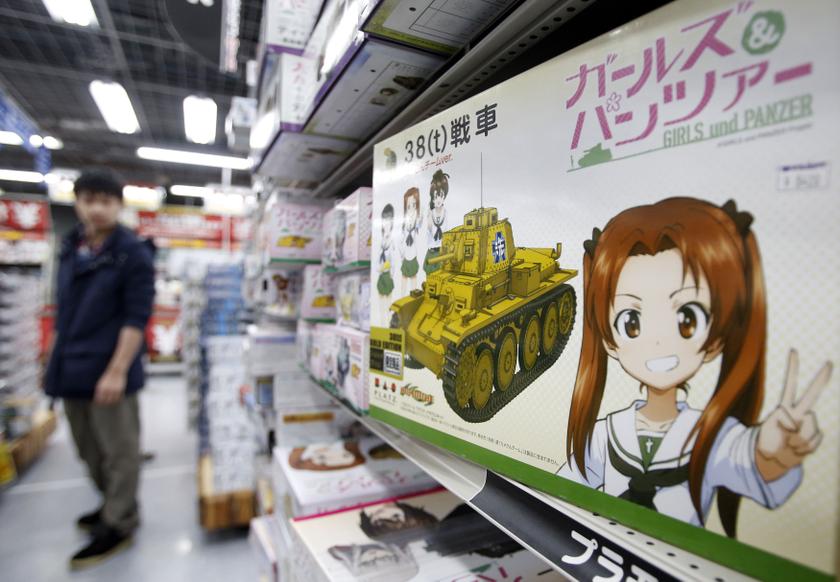 A box of a tank model featuring animation Girls and Panzers is displayed at a retail store in Tokyo's Akihabara district March 13, 2014. Being a soldier in Japan after World War Two was seen as a job for failed police recruits and unemployed youth from de