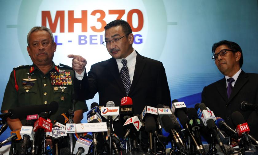 Datuk Seri Hishammuddin Hussein answers questions between Chief of Armed Forces General Tan Sri Zulkifeli Mohd Zin and Department of Civil Aviation's Director General Datuk Azharuddin Abdul Rahman in Sepang March 12, 2014.  u00e2u20acu201d Reuters pic
