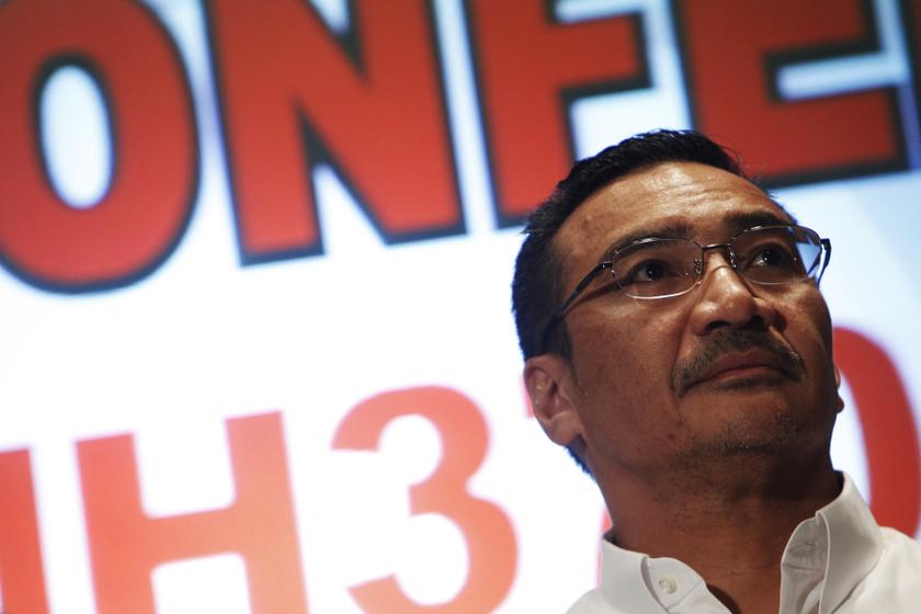 Malaysia's acting Transport Minister Datuk Seri Hishammuddin Hussein listens during a news conference about the missing Malaysia Airlines flight MH370, at Kuala Lumpur International Airport March 16, 2014. u00e2u20acu201d Reuters pic