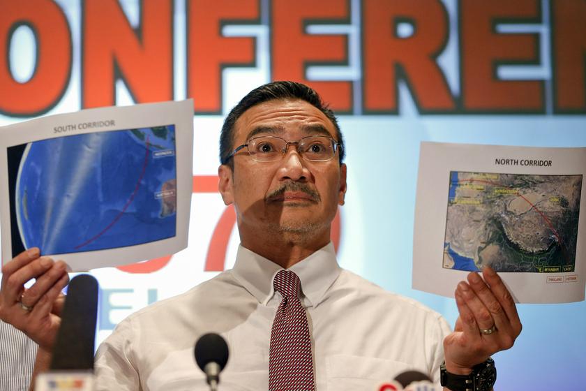 Acting Transport Minister Datuk Seri Hishammuddin Hussein shows two maps with corridors of the last known possible location of the missing Malaysia Airlines MH370 plane in Sepang March 17, 2014. u00e2u20acu201d Reuters pic