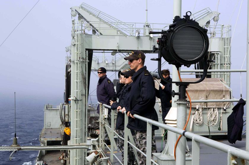 Crew members of HMAS Success look out from the deck during the search for missing flight MH370 in this picture released by the Australian Defence Force March 25, 2014. u00e2u20acu2022 Reuters picn