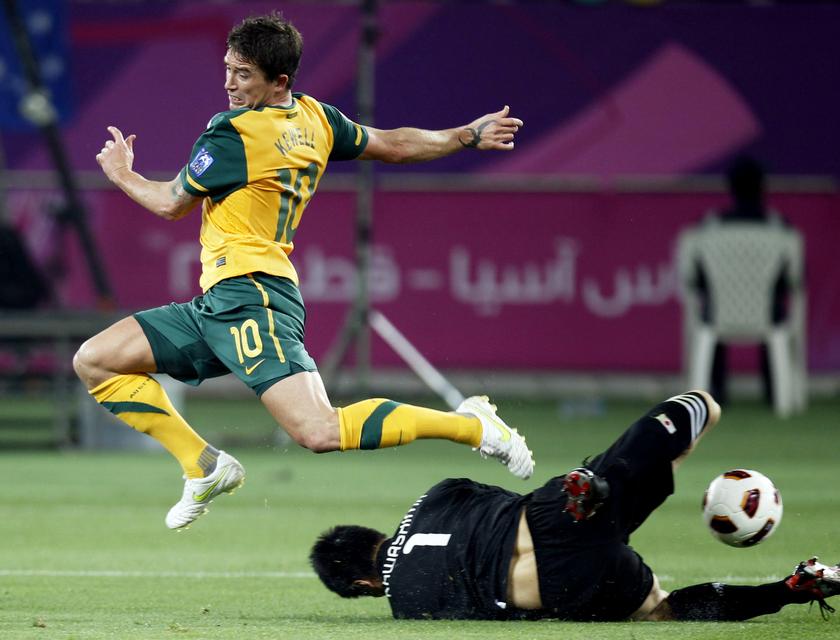 Australia's Harry Kewell (left) jumps over Japan's goalkeeper Eiji Kawashima during their 2011 Asian Cup final soccer match at Khalifa stadium in Doha in this January 29, 2011 file photo. u00e2u20acu201du00c2u00a0Reuters pic