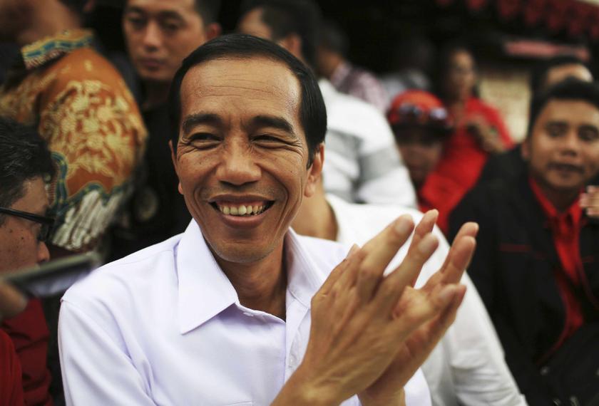 Jakarta governor and presidential candidate Joko Widodo, of the Indonesian Democratic Party of Struggle, reacts during a party campaign at Cengkareng soccer field in Jakarta March 16, 2014. u00e2u20acu201d Reuters pic