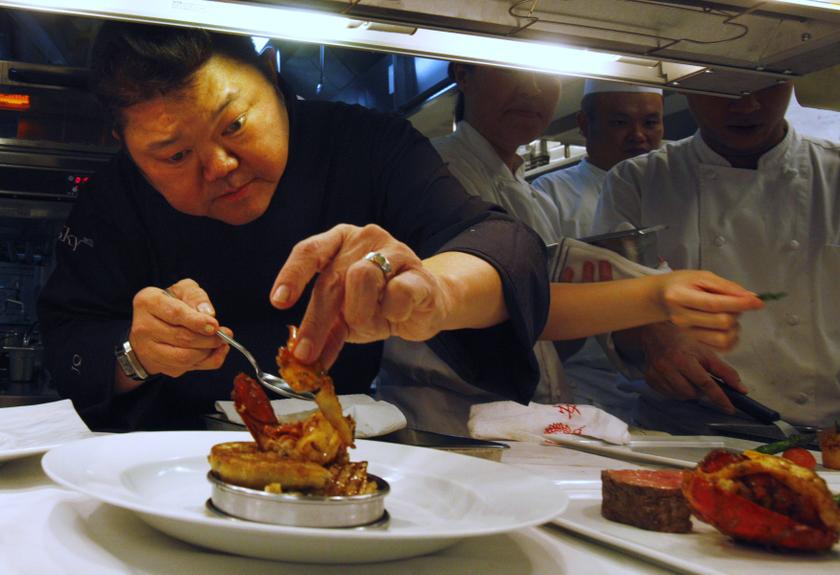 Singaporean chef Justin Quek plates a dish in his kitchen at Sky On 57 restaurant at Marina Bay Sands in Singapore November 4, 2013. — Reuters pic