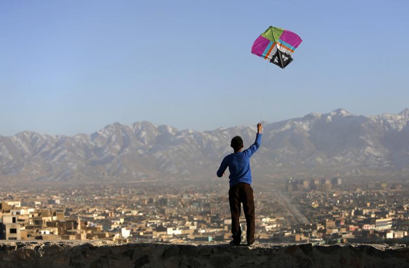 An Afghan boy flies a kite on a hilltop overlooking Kabul February 17, 2014. u00e2u20acu201d Reuters pic