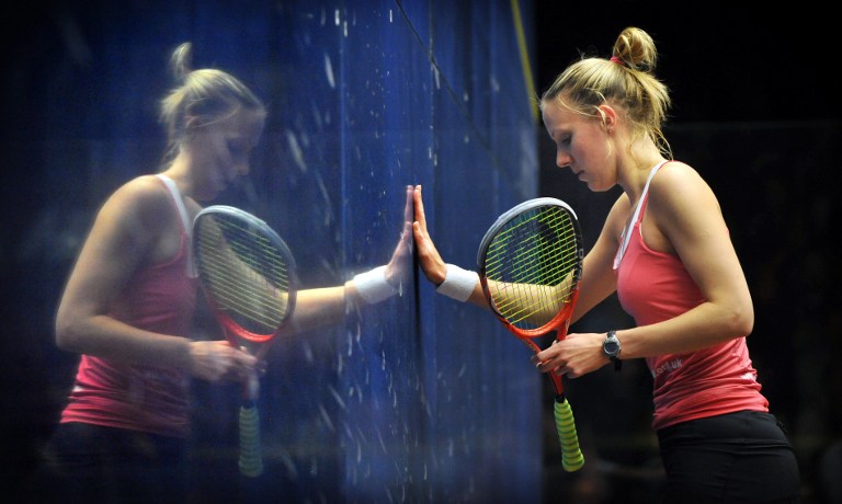Laura Massaro of England (right) is reflected in the glass during the women's final against Nicol David of Malaysia at the Australian Open squash tournament in Canberra in August 19, 2012. u00e2u20acu201d AFP pic