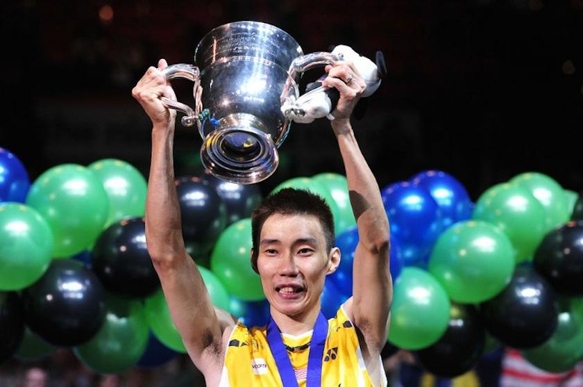 Datuk Lee Chong Wei holds a trophy after beating Chen Long of China in their All England Open Badminton Championships menu00e2u20acu2122s singles final match in Birmingham March 9, 2014. u00e2u20acu201d AFP pic