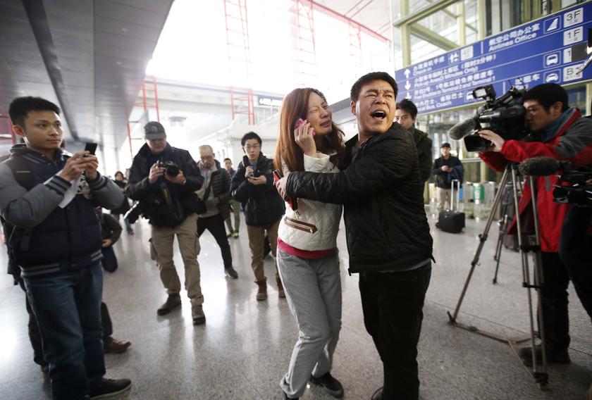A woman, believed to be the relative of a passenger onboard Malaysia Airlines flight MH370, cries as she talks on her mobile phone at the Beijing Capital International Airport in Beijing, March 8, 2014. u00e2u20acu201d Reuters pic