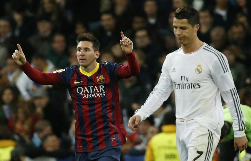 Barcelona's Lionel Messi (L) celebrates a goal next to Real Madrid's Cristiano Ronaldo at Santiago Bernabeu stadium in Madrid March 23, 2014. u00e2u20acu201d Reuters pic