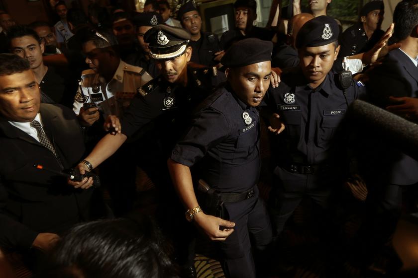 Police block reporters from following Chinese family members of the missing MH370 passengers at a hotel near KLIA March 19, 2014. — Reuters pic