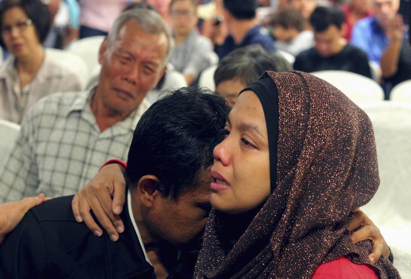 Family members of those on board the missing Malaysia Airlines flight MH370 cry at a hotel in Putrajaya March 9, 2014. u00e2u20acu201d Reuters pic