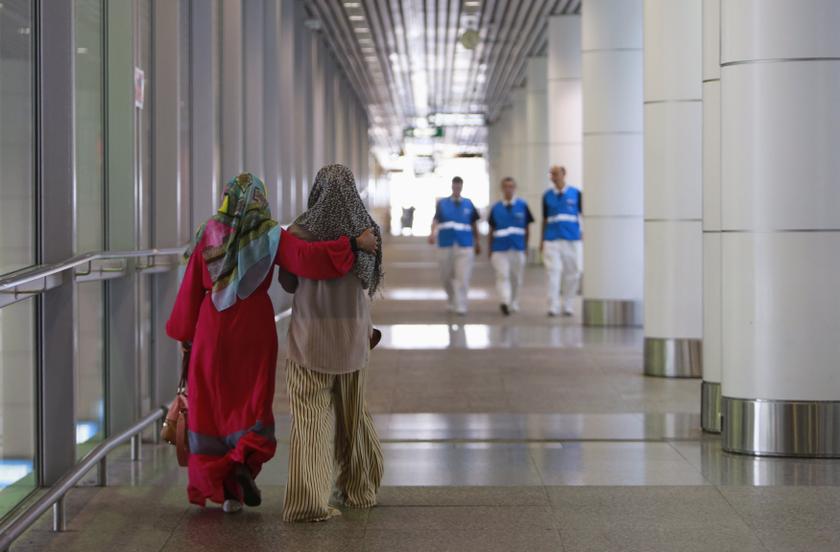 Family members (left) of those onboard the missing Malaysia Airlines flight walk into the waiting area at Kuala Lumpur International Airport in Sepang March 8, 2014. u00e2u20acu201d Reuters pic