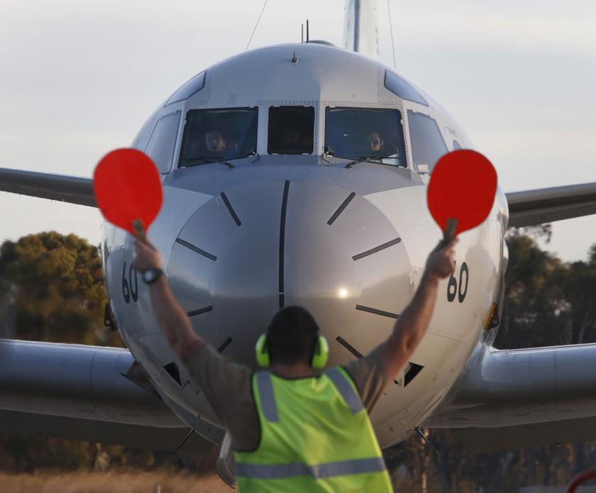 One of two Japanese Government P-3 aircraft to arrive at RAAF base Pearce is guided to a stop March 23, 2014 in Bullsbrook near Perth. u00e2u20acu201d Reuters pic 
