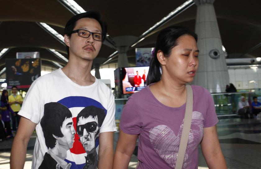 Family members of those onboard the missing Malaysia Airlines flight walk into the waiting area at Kuala Lumpur International Airport in Sepang March 8, 2014. u00e2u20acu201d Reuters pic