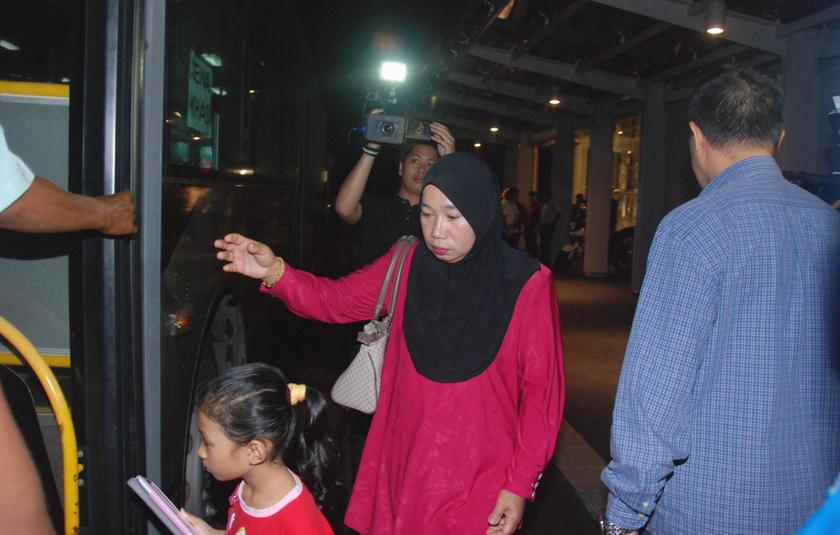 Family members of Malaysian passengers aboard the missing flight MH370 leaving the Everly Hotel in Putrajaya to attend a briefing with Malaysian authorities at the Cyberview Lodge and Spa, on March 20, 2014.u00e2u20acu201d Picture by Mohd Yusof Mat Isa