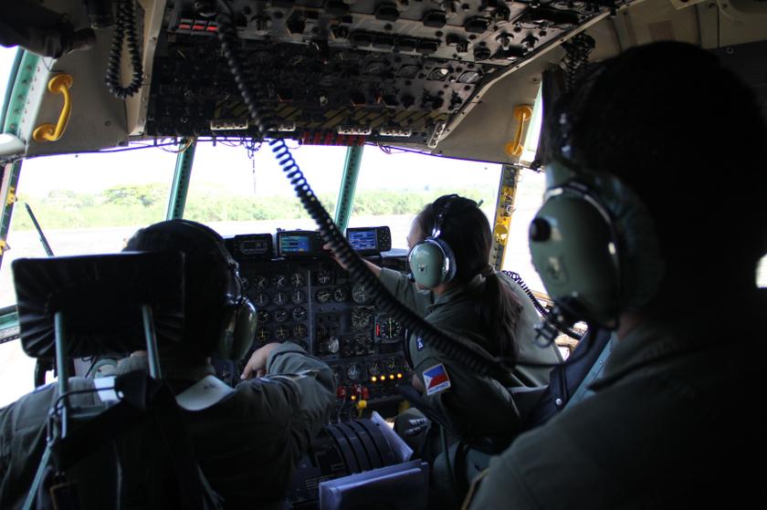 Members of the Philippine Air Force Search and Rescue team aboard a C130 military plane search for the missing Malaysian Airlines on western Philippine sea March 11, 2014. u00e2u20acu201d Reuters pic