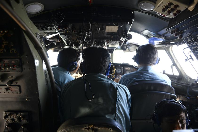 Vietnamese Air Force officers sit in the cockpit of a search and rescue aircraft as they fly over the search area for a missing Malaysia Airlines plane March 9, 2014. u00e2u20acu201d Reuters pic