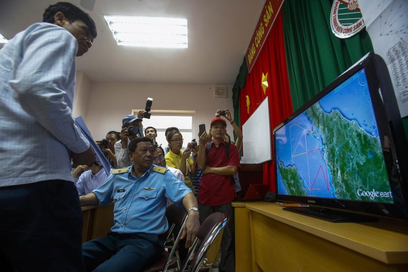 Deputy commander of Vietnam Air Force Do Minh Tuan looks at a map on a TV screen during a news conference about their mission to find missing Malaysia Airlines flight MH370 at Phu Quoc Airport on Phu Quoc Island March 11, 2014. — Reuters pic